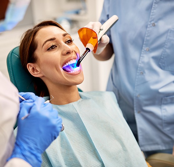 Dental patient receiving tooth-colored filling